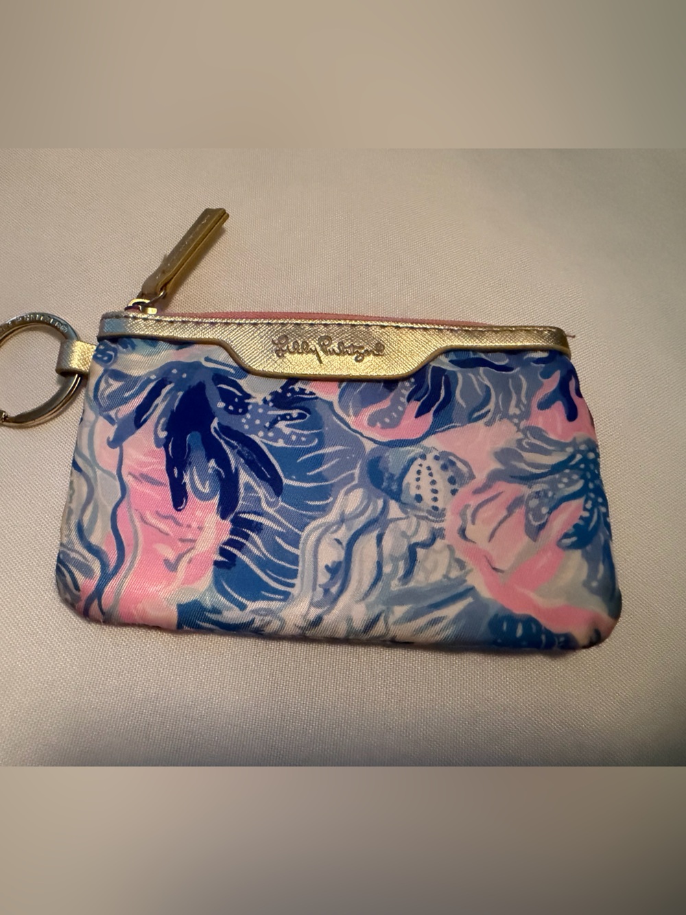 Lilly Pulitzer Pink with Light Blue ID pouch.